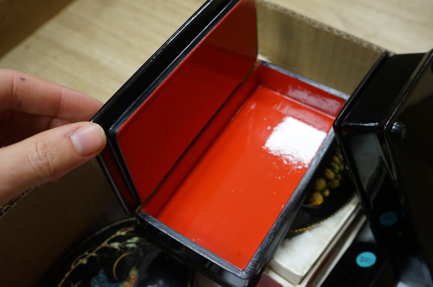 A quantity of mostly 20th century Russian lacquer boxes, a match striker and snuff boxes, some with original receipts. Condition - appears good